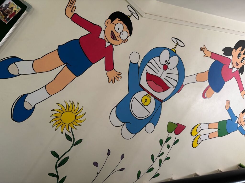 A painted mural along one of the school walls