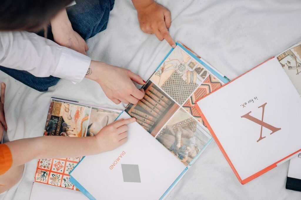 Small hands arranging letter cards and paper on a table